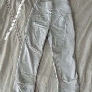 New white Lululemon leggings with cute detailing, size 4!